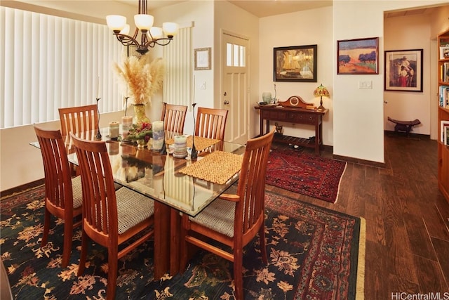 dining room featuring an inviting chandelier and dark hardwood / wood-style floors