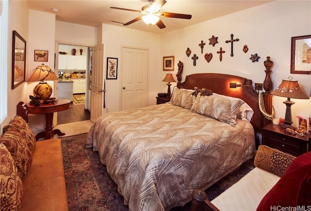 bedroom with hardwood / wood-style floors and ceiling fan