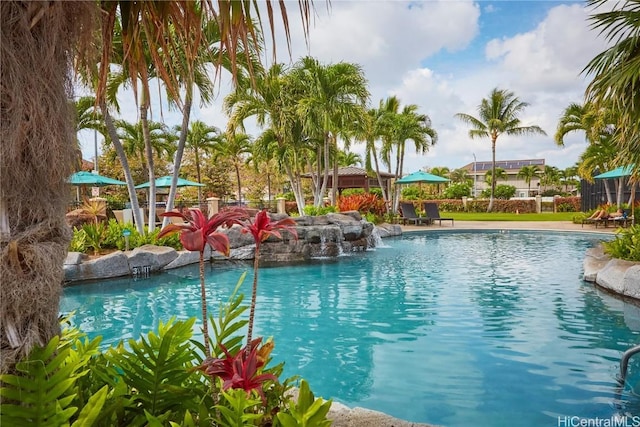 view of swimming pool featuring pool water feature and a gazebo