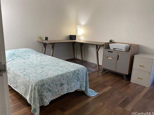 bedroom featuring dark wood-type flooring