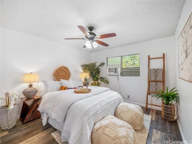 bedroom featuring a textured ceiling, dark hardwood / wood-style flooring, ceiling fan, and cooling unit