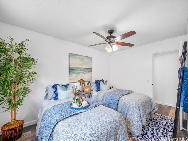 bedroom featuring hardwood / wood-style floors and ceiling fan