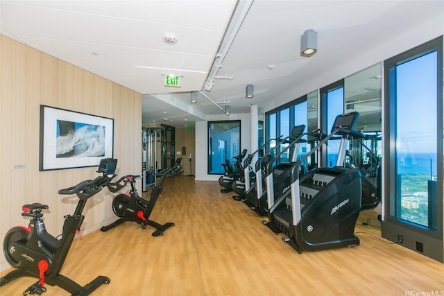 987 Queen St Unit 1401, Honolulu, HI 96814 - gym with wood finished floors and rail lighting