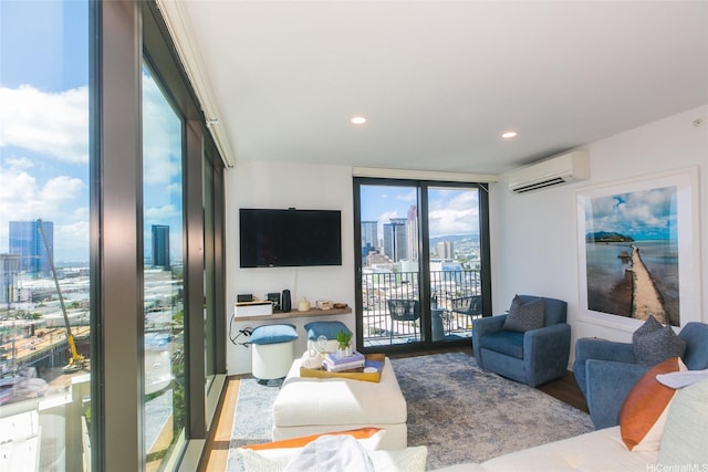 987 Queen St Unit 1401, Honolulu, HI 96814 - living room with a wall mounted air conditioner, plenty of natural light, wood finished floors, expansive windows, and recessed lighting