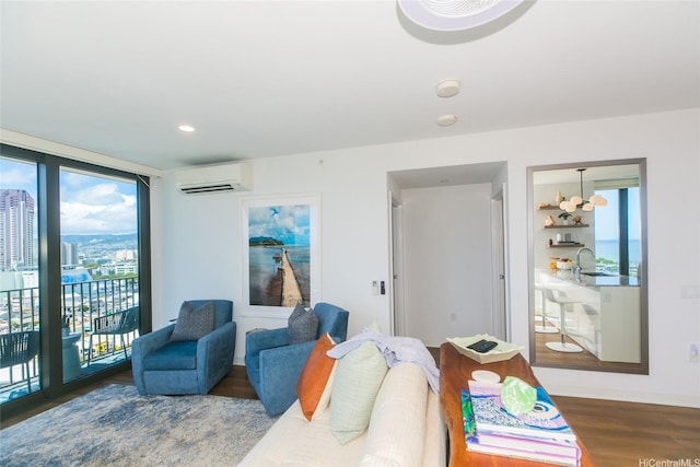 987 Queen St Unit 1401, Honolulu, HI 96814 - living area featuring a wall mounted air conditioner, wood finished floors, baseboards, and recessed lighting