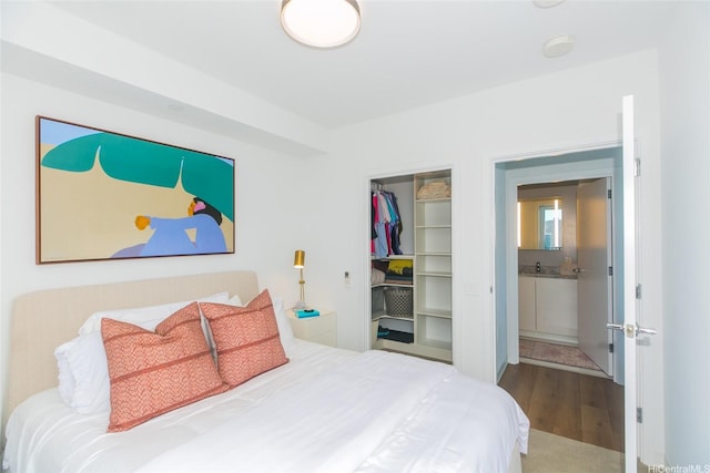 987 Queen St Unit 1401, Honolulu, HI 96814 - bedroom with wood finished floors and a closet
