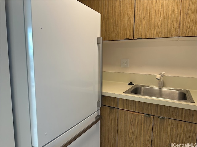 kitchen with white fridge and sink