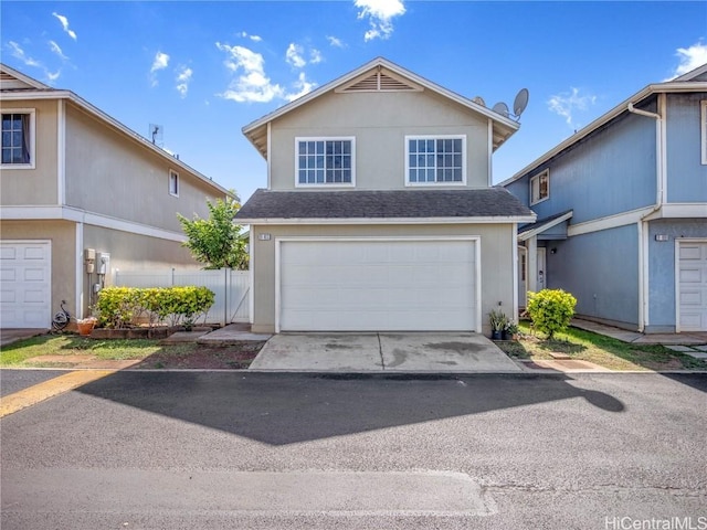 front of property with a garage