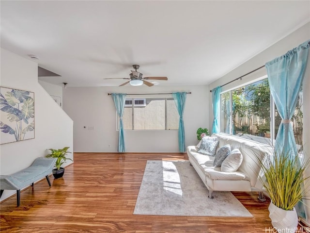 sitting room with ceiling fan and light hardwood / wood-style floors