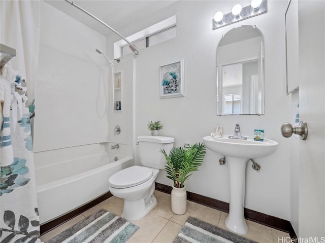 full bathroom with baseboards, shower / tub combo, toilet, and tile patterned floors