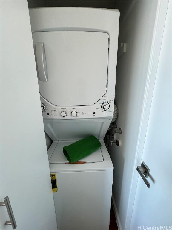 laundry room featuring stacked washing maching and dryer