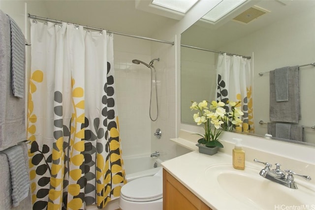 full bathroom with vanity, shower / bath combination with curtain, and toilet