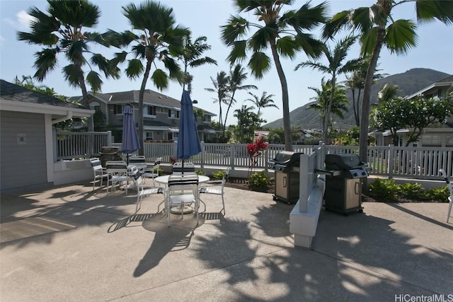 view of patio / terrace with a grill and a mountain view