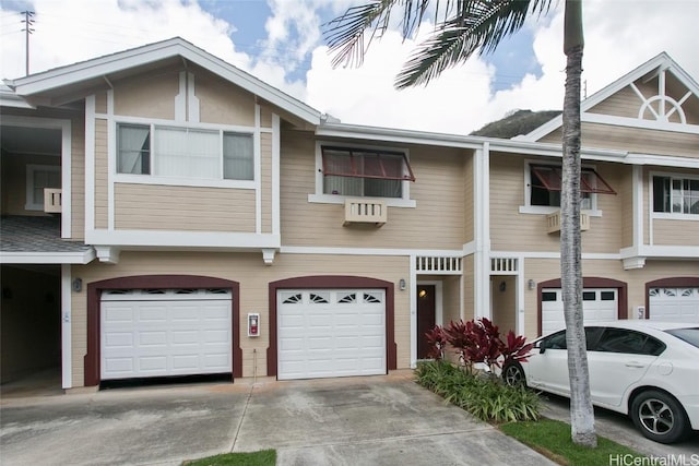 townhome / multi-family property featuring a garage