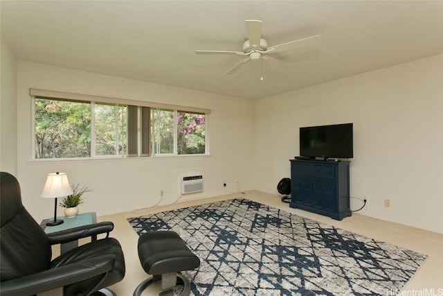 living area featuring ceiling fan and an AC wall unit