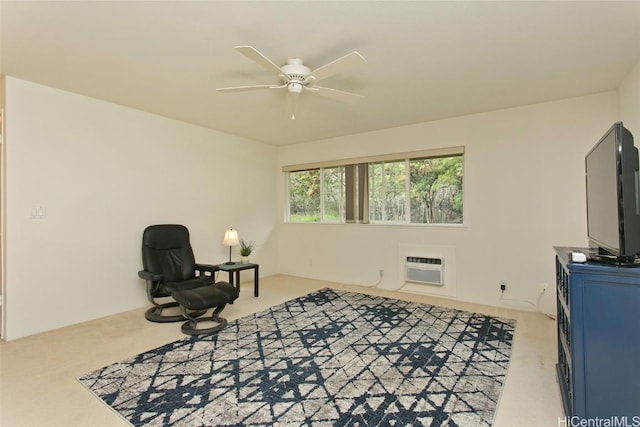 living area with ceiling fan, light carpet, and a wall unit AC