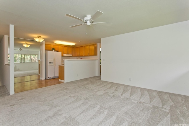 7128 Hawaii Kai Dr Unit 97, Honolulu, HI 96825 - unfurnished living room with light colored carpet and ceiling fan