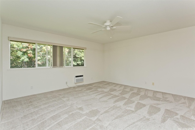 7128 Hawaii Kai Dr Unit 97, Honolulu, HI 96825 - unfurnished room featuring a ceiling fan, light carpet, and an AC wall unit