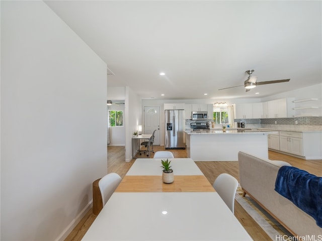 dining area with recessed lighting, baseboards, ceiling fan, and light wood finished floors