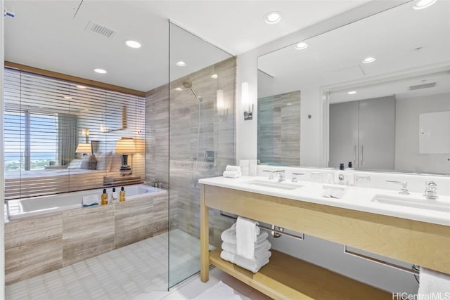 bathroom featuring vanity and plus walk in shower