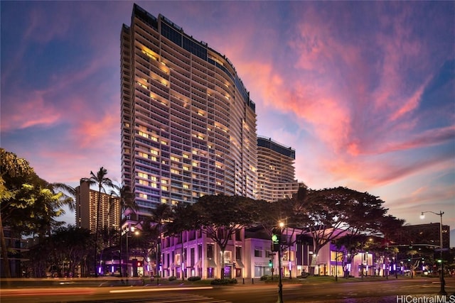 view of outdoor building at dusk