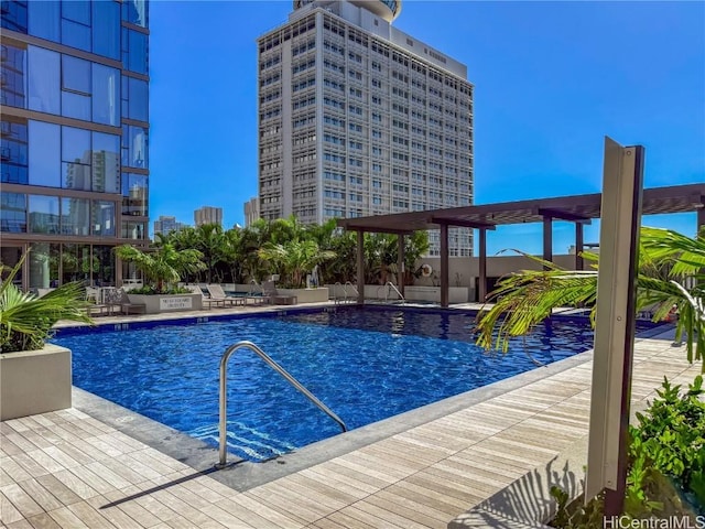 view of swimming pool featuring a patio area and a pergola