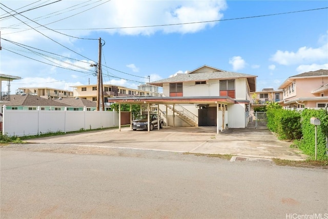 view of front of home with a carport