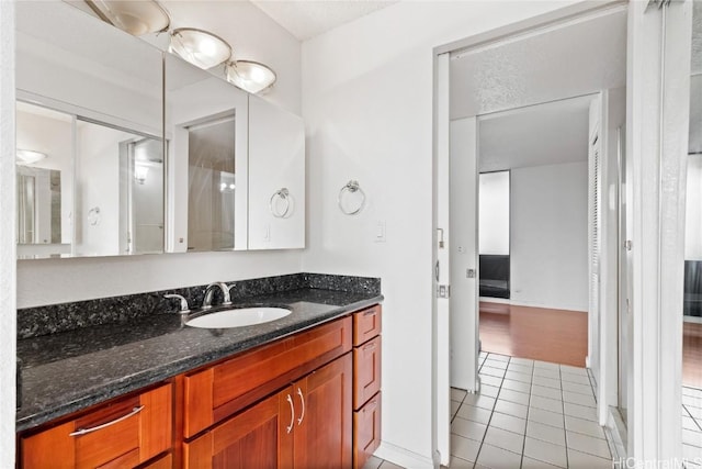 bathroom with tile patterned flooring and vanity