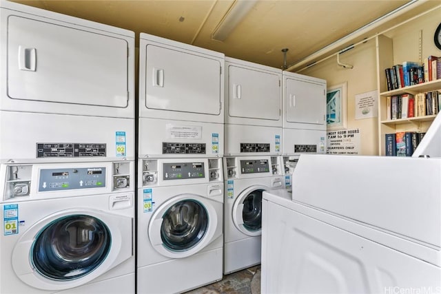 clothes washing area featuring stacked washing maching and dryer and independent washer and dryer