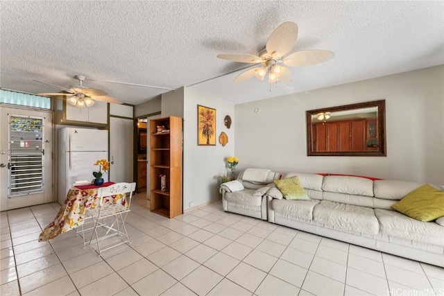 tiled living room featuring ceiling fan and a textured ceiling