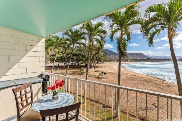 balcony with a water and mountain view