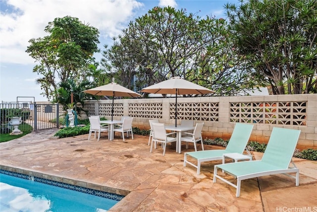 view of patio / terrace featuring a fenced in pool