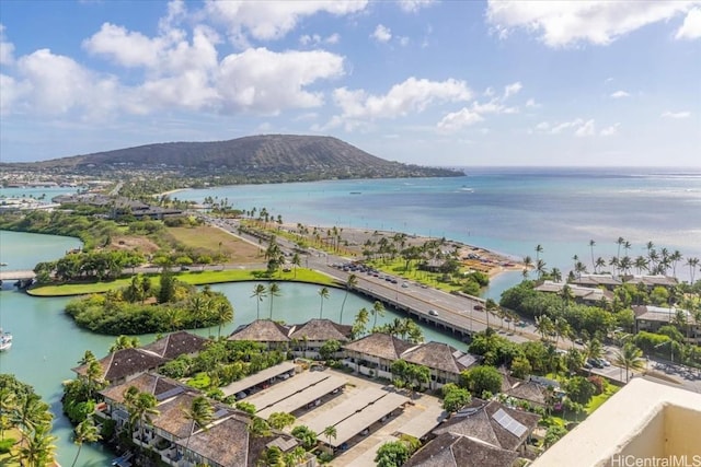 birds eye view of property featuring a water and mountain view