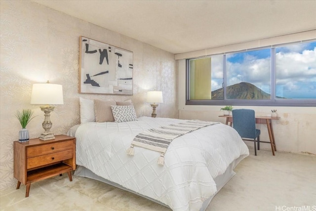 carpeted bedroom featuring a mountain view