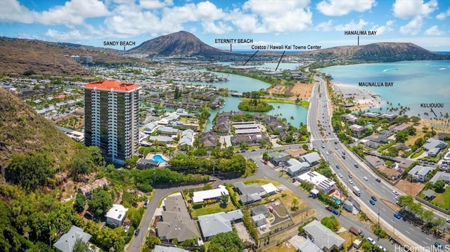 aerial view featuring a water and mountain view