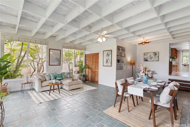 dining room with coffered ceiling, beam ceiling, and ceiling fan