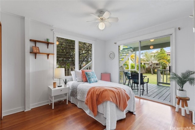 bedroom featuring ceiling fan, access to outside, and wood-type flooring