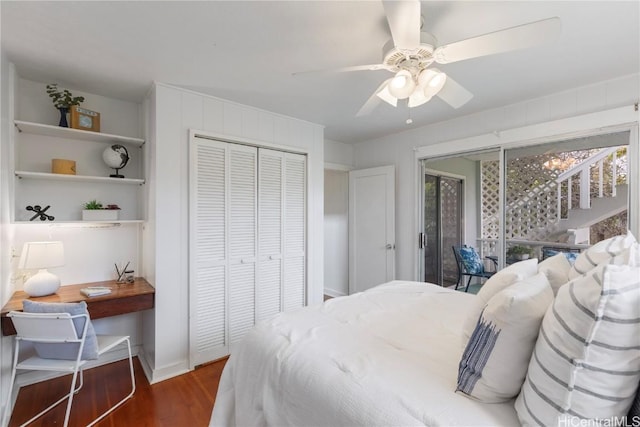 bedroom featuring multiple windows, a closet, dark hardwood / wood-style floors, and ceiling fan