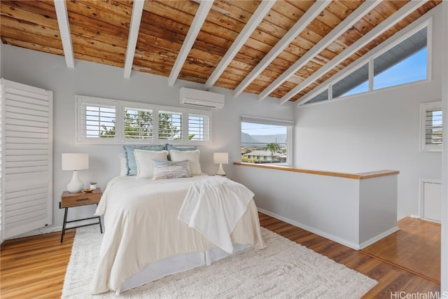 bedroom featuring wood ceiling, hardwood / wood-style flooring, a wall unit AC, and vaulted ceiling with beams