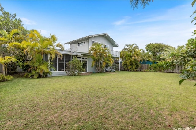 view of yard featuring a sunroom