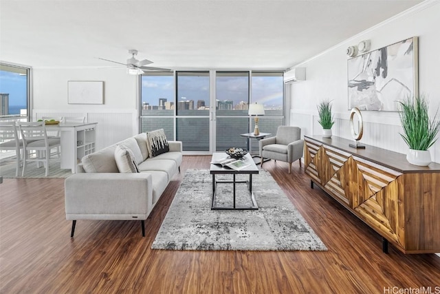 living room with floor to ceiling windows, ceiling fan, dark hardwood / wood-style floors, a wall unit AC, and crown molding