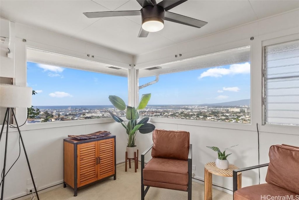 sunroom / solarium with ceiling fan