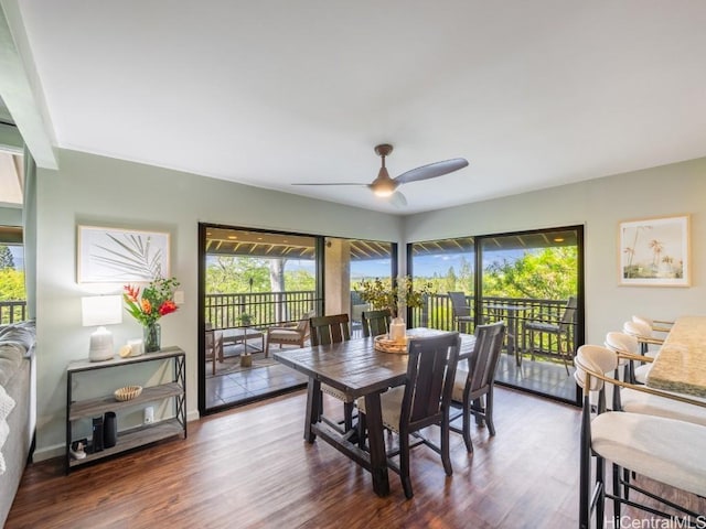 dining area with ceiling fan and dark hardwood / wood-style flooring