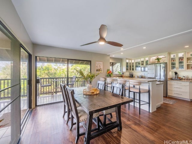 dining room featuring ceiling fan and wood-type flooring