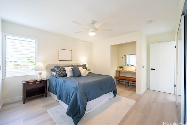 bedroom with light hardwood / wood-style flooring and ceiling fan