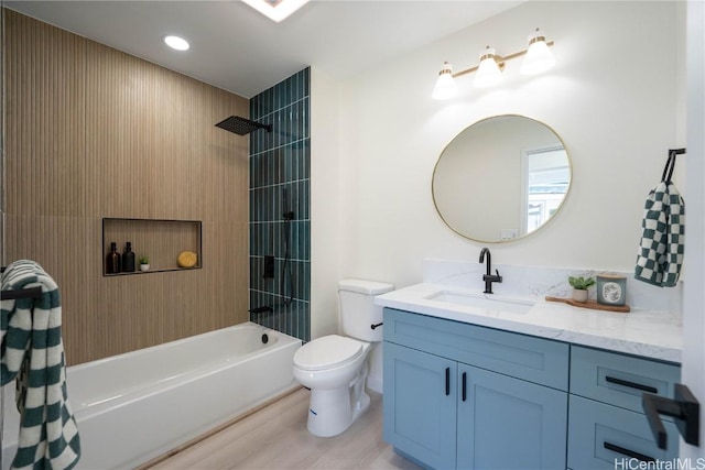 full bathroom with hardwood / wood-style flooring, shower / bath combo with shower curtain, vanity, and toilet