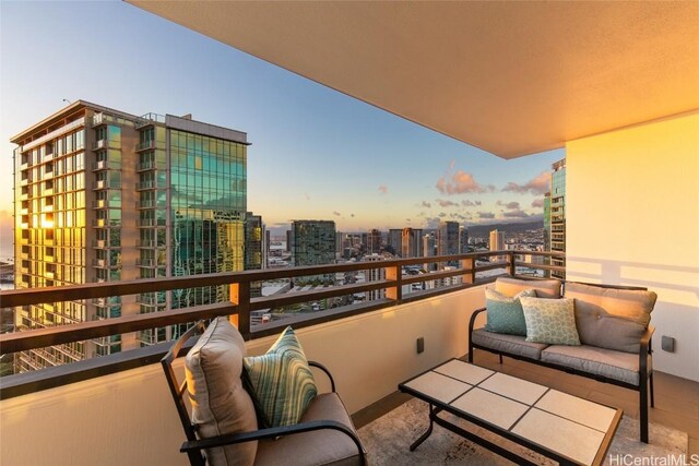 view of balcony at dusk