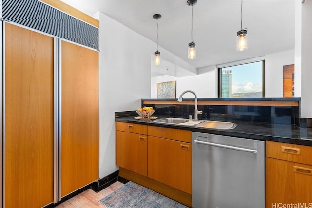 kitchen with dishwasher, paneled fridge, sink, and pendant lighting