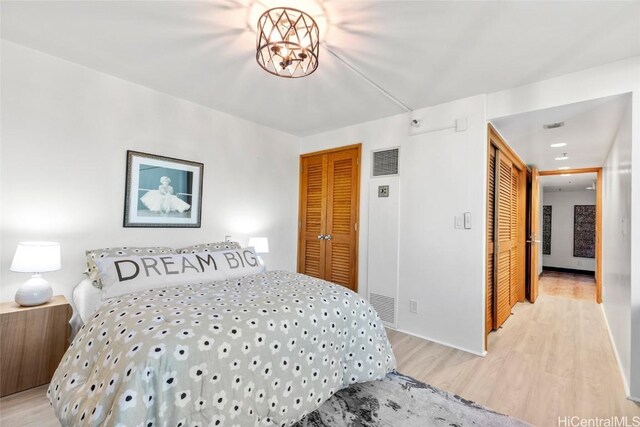 bedroom featuring light hardwood / wood-style floors and a closet