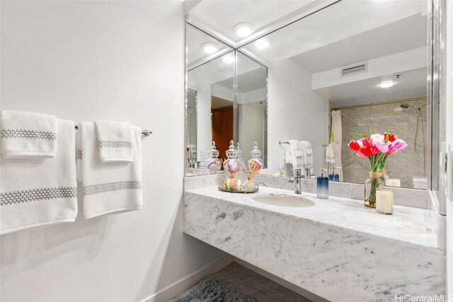 bathroom with sink and a shower with curtain